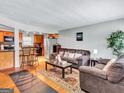 Cozy living room flows into an eat-in kitchen area perfect for relaxing or entertaining in a casual setting at 3059 Will Rogers Se Pl, Atlanta, GA 30316
