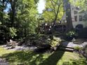 Inviting backyard with deck, fire pit, lush landscaping and terraced garden at 3146 Weymouth Dr, Marietta, GA 30062