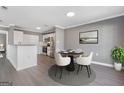 Cozy dining area featuring contemporary furnishings and adjacent kitchen at 504 Mill Pond Se Ct, Smyrna, GA 30082