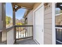 View of the unit 504's entryway with outdoor access overlooking a pool at 504 Mill Pond Se Ct, Smyrna, GA 30082