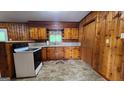 Classic kitchen with wood cabinets, white appliances, and a cozy atmosphere at 305 Flat Shoals Church Rd, Stockbridge, GA 30281