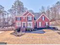 Charming two-story brick home with manicured lawn and a well-maintained landscape at 4213 Bretdale Nw Run, Kennesaw, GA 30152