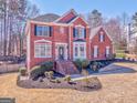 Attractive two-story brick home featuring manicured landscaping and a welcoming front facade at 4213 Bretdale Nw Run, Kennesaw, GA 30152
