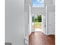 Bright foyer showcasing wood floors and an open view to the front yard at 4506 White Rd, Douglasville, GA 30135