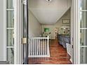 Inviting entryway featuring hardwood floors, and a view into the living room at 6645 N Glen Dr, Cumming, GA 30028