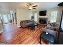 Comfortable living room featuring a fireplace and views to the entryway at 110 Shelby Oaks Trl, Covington, GA 30016