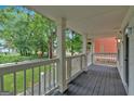 Inviting front porch with classic railing, offering a perfect spot for relaxation at 786 Neal Nw St, Atlanta, GA 30318