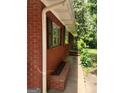 Side view of a traditional brick home showing clean gutters and landscaping at 856 New Hope Rd, Fayetteville, GA 30214