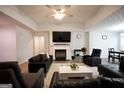 Inviting living room features a fireplace and a ceiling fan at 9067 Bob Jackson Dr, Jonesboro, GA 30238