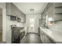 Well-equipped kitchen with stainless steel appliances and ample cabinet space at 1684 Lake Harbin Rd, Morrow, GA 30260