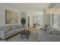 Bright living room with a gray sofa set, area rug, artwork, and a dining area near a large window at 1684 Lake Harbin Rd, Morrow, GA 30260