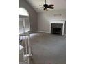 Bright living room with a vaulted ceiling, fireplace and french doors to the outside at 227 Cedars Glen Cir, Villa Rica, GA 30180