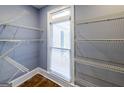 Spacious walk-in closet with a window and lots of adjustable wire shelving at 5780 Pumkintown Rd, Douglasville, GA 30135