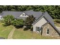 Charming exterior elevation with stone accents and well-maintained landscaping at 5780 Pumkintown Rd, Douglasville, GA 30135
