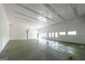 Spacious garage with high ceilings and ample room for storage and activities at 5780 Pumkintown Rd, Douglasville, GA 30135