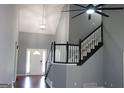 Grand foyer with a staircase, chandelier, and high ceilings that add an elegant touch at 74 Flanders Ct, Douglasville, GA 30134
