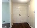 Welcoming entryway featuring double doors, hardwood floors, and neutral wall paint at 443 S Rays Rd, Stone Mountain, GA 30083