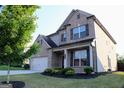 Corner lot featuring a two-story home with manicured lawn and tree lined perimeter at 878 W Union Grove Cir, Auburn, GA 30011