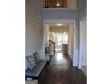 Entry foyer with hardwood floors, bench seating, and access to the main living area at 878 W Union Grove Cir, Auburn, GA 30011