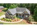 A detailed aerial view of a home showcasing its landscaping, and backyard at 150 Cold Harbor Ct, Sharpsburg, GA 30277