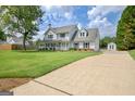Traditional two-story home featuring a welcoming front porch and well-maintained landscaping at 503 Atwood Cir, Peachtree City, GA 30269