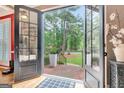 Inviting view through the glass paneled front door to the landscaped front yard at 111 Biltmore Trce, Peachtree City, GA 30269