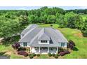 Aerial view of the home showing roof, landscaping, and rocking chair front porch at 377 Parker Rd, Mcdonough, GA 30252