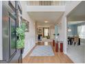 Welcoming entryway with hardwood floors, high ceilings, and an open view into the living and dining areas at 2990 Haynes Club Cir, Grayson, GA 30017
