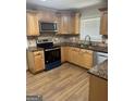 Well-equipped kitchen featuring stainless steel appliances and granite countertops at 113 Ausband Dr, Mcdonough, GA 30253