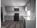 Modern kitchen with updated appliances, new countertops, and ample cabinet space at 2615 Old South Ct, Jonesboro, GA 30236