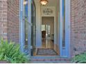 A welcoming foyer featuring wood floors, a 'Blessed' sign, and natural light at 809 Mcbean Ct, Mcdonough, GA 30252