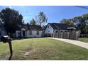 Exterior shot of a well-manicured front lawn with mailbox and a driveway beside the home at 1132 Se Oak Knoll Ter, Atlanta, GA 30315