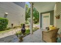 Inviting patio with stone flooring, wicker seating, and a cozy outdoor fireplace at 4128 Hunt Sw St, Covington, GA 30014