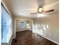Bright living room featuring beautiful hardwood floors, with lots of natural light from large windows at 1901 Clarke Ln, Decatur, GA 30035