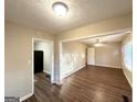 Open-concept living space showcasing hardwood floors and neutral wall paint at 1901 Clarke Ln, Decatur, GA 30035