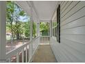 Covered porch with white railing offers serene outdoor space and natural light at 2894 Cushing Ct, Jonesboro, GA 30236