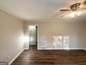 Bright living room featuring hardwood floors, neutral walls, and a ceiling fan at 2159 Holly Hill Dr, Decatur, GA 30032
