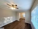 Living room with hardwood floors, natural light, and open access to the dining area at 2159 Holly Hill Dr, Decatur, GA 30032