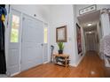 Welcoming foyer with hardwood floors, a shoe rack and coat rack at 7358 S Mitchell Ct, Villa Rica, GA 30180