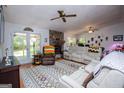 Bright living room featuring a stone fireplace and cozy seating at 7358 S Mitchell Ct, Villa Rica, GA 30180