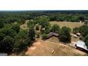 Aerial view of the horse property with sprawling acreage, barn, and well-maintained house at 1024 Bethany Rd, Covington, GA 30016