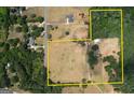 Large lot features open fields, wooded areas, outbuildings and a home site, outlined in yellow at 1024 Bethany Rd, Covington, GA 30016