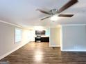 Spacious living room with wood flooring, recessed lighting, and large windows for ample natural light at 51 Springside Se Dr, Atlanta, GA 30354