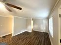 Bright and open living room featuring new flooring and trim, with fresh paint at 51 Springside Se Dr, Atlanta, GA 30354