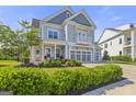 Charming two-story home with a three-car garage and manicured front lawn and beautiful landscaping at 229 Widener Way, Peachtree City, GA 30269