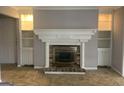 Cozy living room with fireplace, built-in shelving, and tiled flooring at 2914 Parc Lorraine, Lithonia, GA 30038