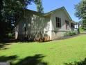 Exterior view of a single-story home on a sunny day at 4382 Highway 42 S, Locust Grove, GA 30248