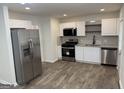 Modern kitchen featuring stainless steel appliances and ample counter space at 3339 Clevemont Ct, Ellenwood, GA 30294