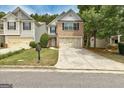 Inviting home with a brick facade, two-car garage, and a neatly landscaped front yard at 737 Shadow Lake Dr, Lithonia, GA 30058