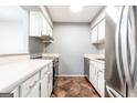 Functional kitchen with white cabinetry and stainless steel appliances, ideal for cooking at 1818 Huntingdon Chase, Atlanta, GA 30350